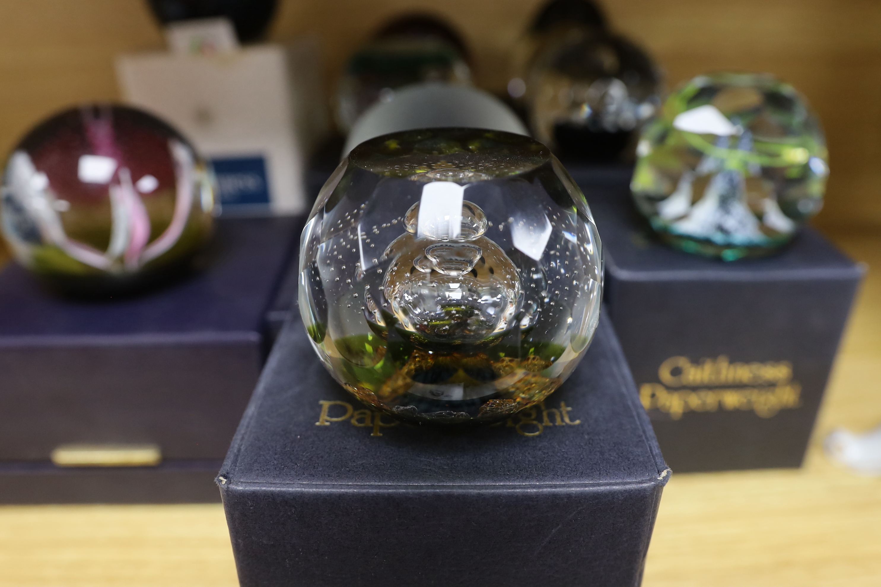 Nine Caithness paperweights including Arctic Night, limited edition 780/1500 and Sea nymphs, 114/350, each with boxes, the largest 9cm high